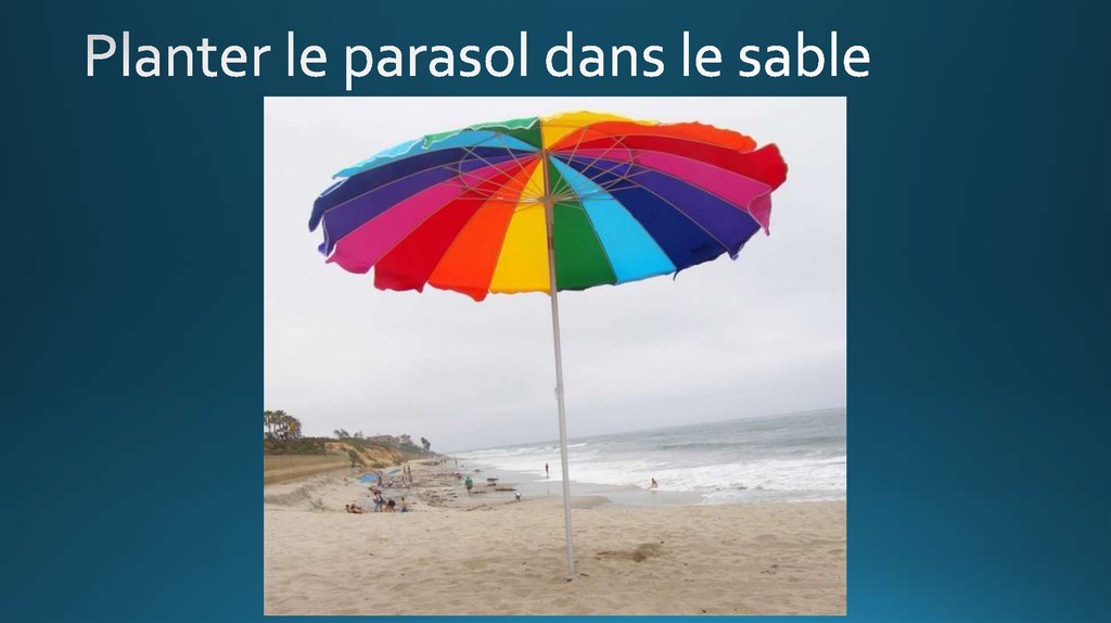 Planter le parasol dans le sable